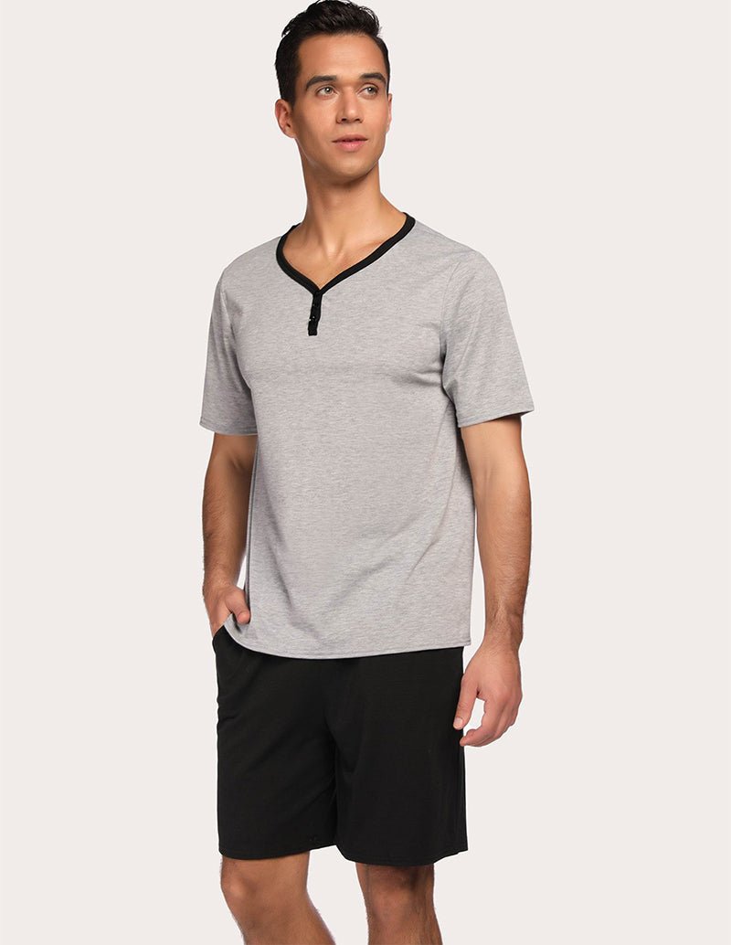 Men's gray V-neck pajama top with black drawstring shorts set