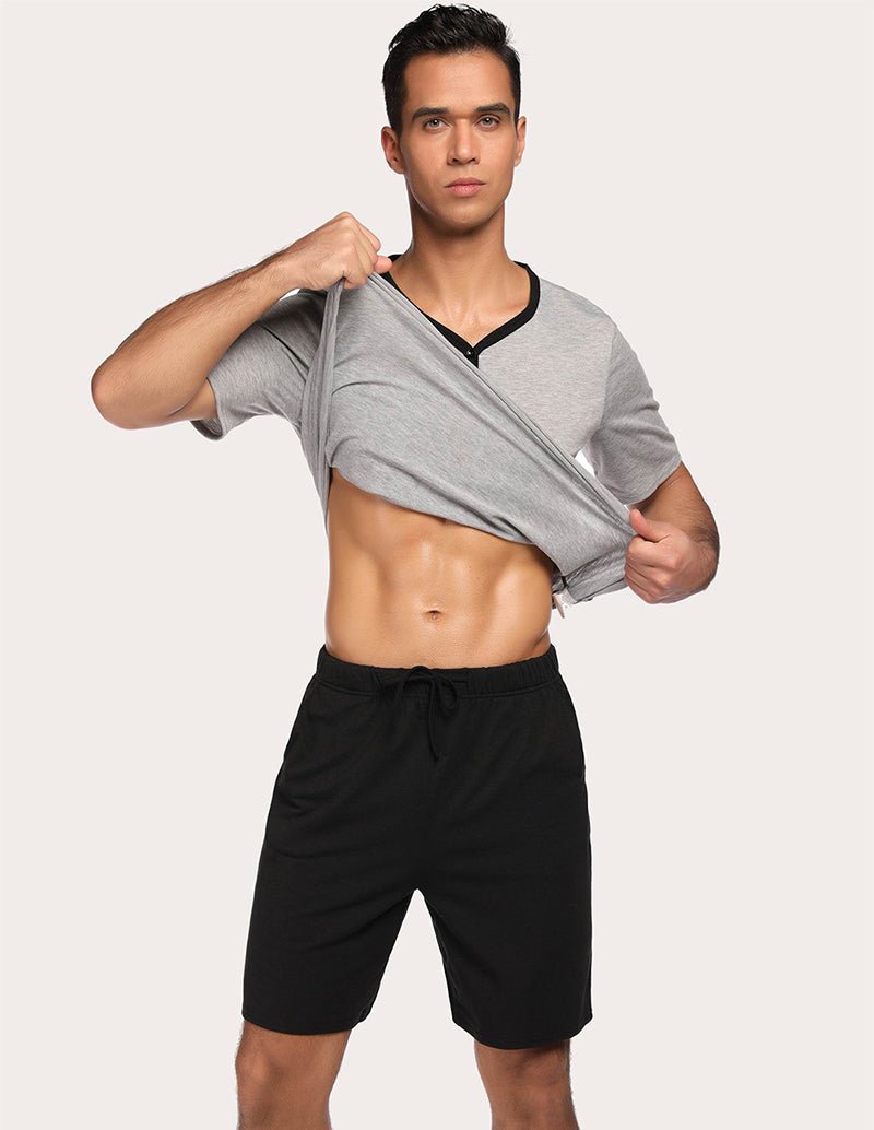 Men's gray pajama top with black drawstring shorts, wrap-style top detail