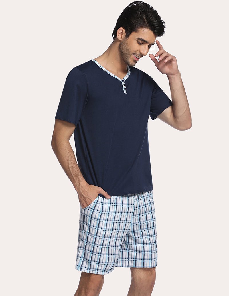 Men's navy short-sleeve henley pajama top with blue plaid sleep shorts