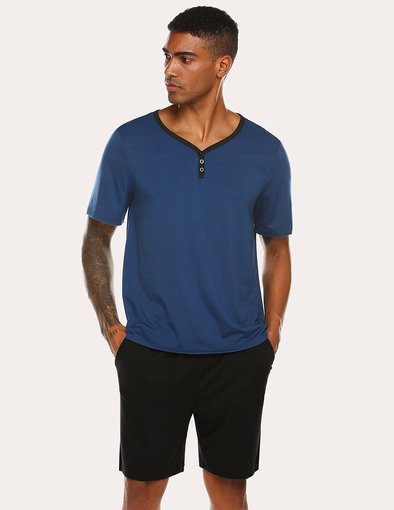 Men's navy short-sleeve henley pajama top with black sleep shorts, button placket