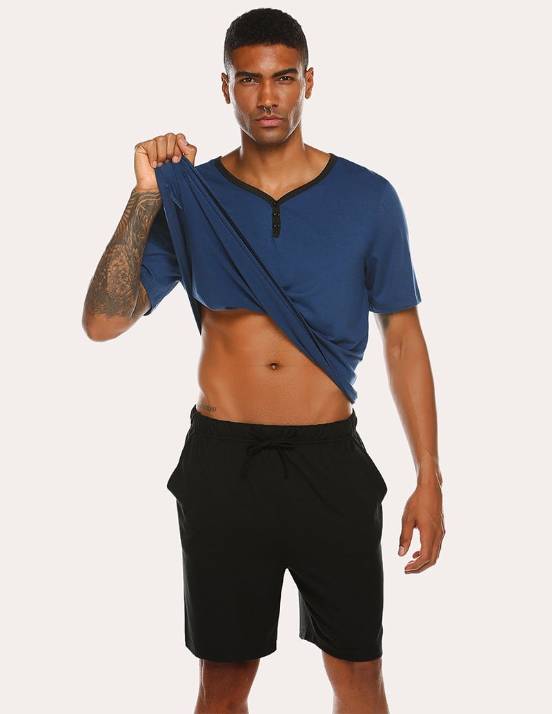 Men's navy henley pajama top with black drawstring shorts, short sleeves