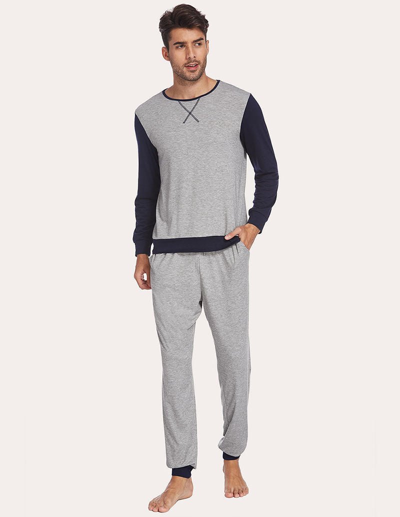 Men's two-piece pajama set with light grey long-sleeve top and navy raglan sleeves