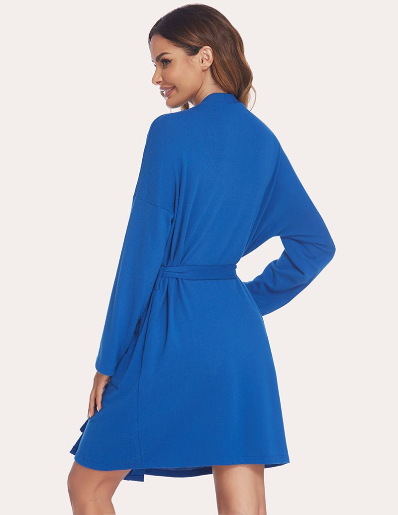Blue robe back view with waist tie, long sleeves, knee-length hem, no hood.