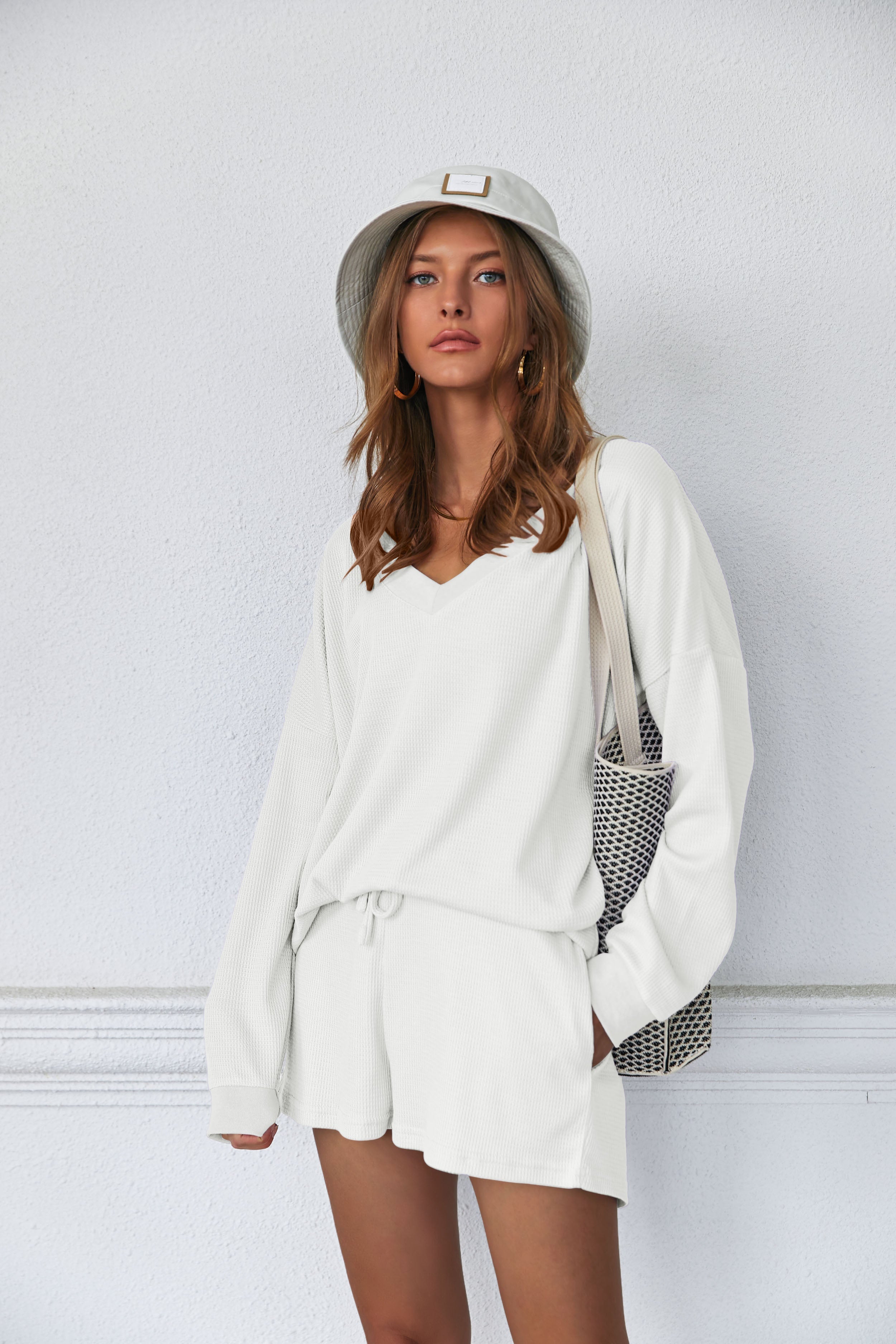 White lounge pajama set: V-neck long-sleeve top with drawstring waist shorts