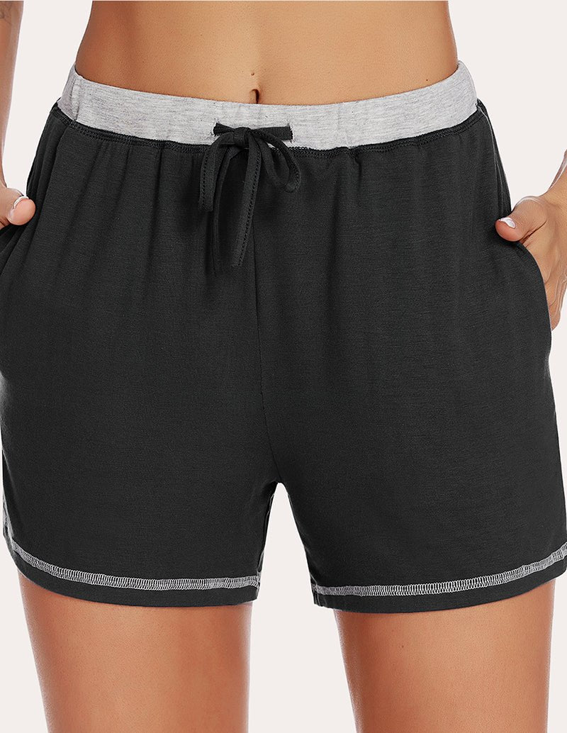 Black pajama shorts front view, light-gray waistband and black drawstring