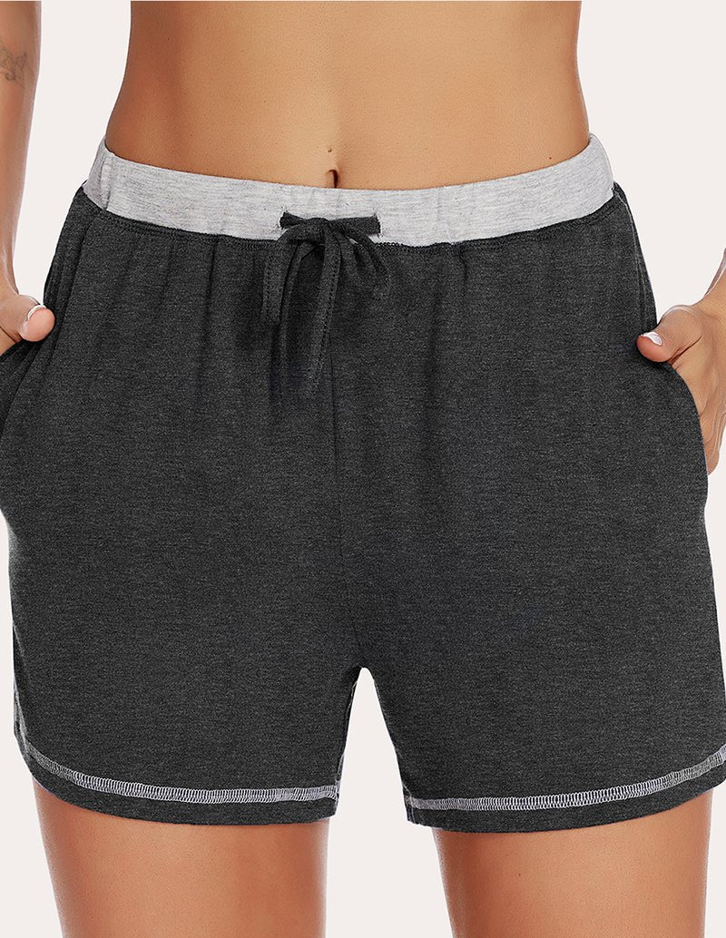 Black pajama shorts front center, light-gray waistband and drawstring with gathers