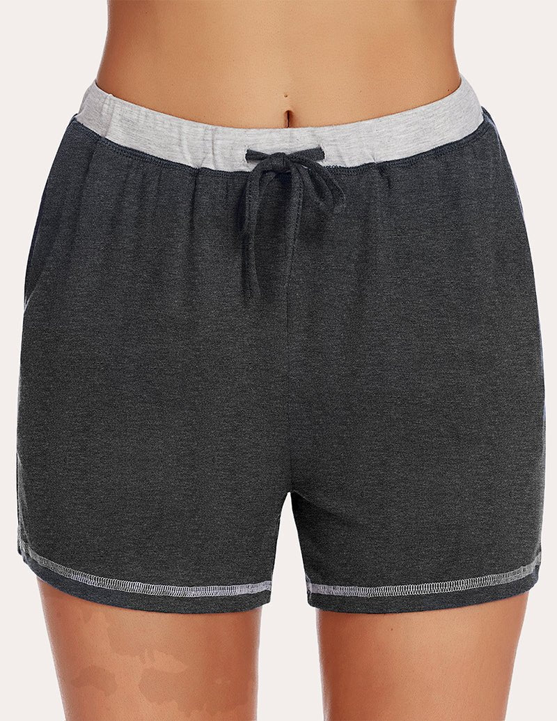 Black pajama shorts with light-gray waistband and black drawstring, straight hem