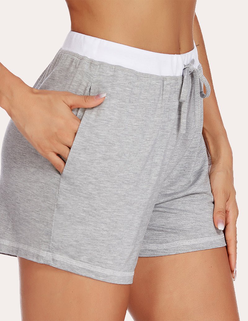 Light grey pajama shorts with white waistband, front tie and side seam