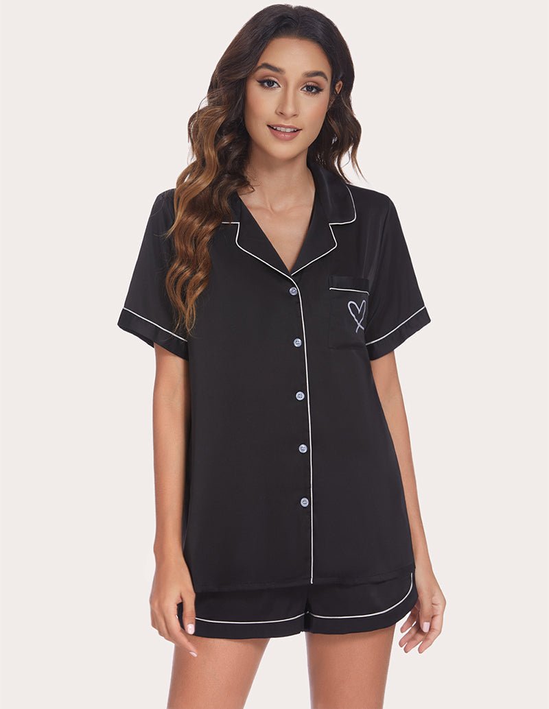 Black piping pajama set with button-front short-sleeve top and matching shorts