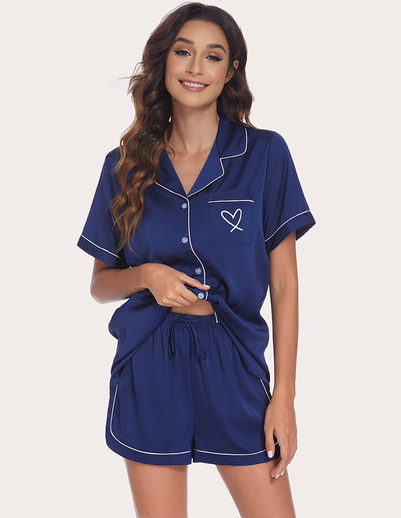 Women's navy pajama set with contrast trim, button-front shirt and drawstring waist shorts