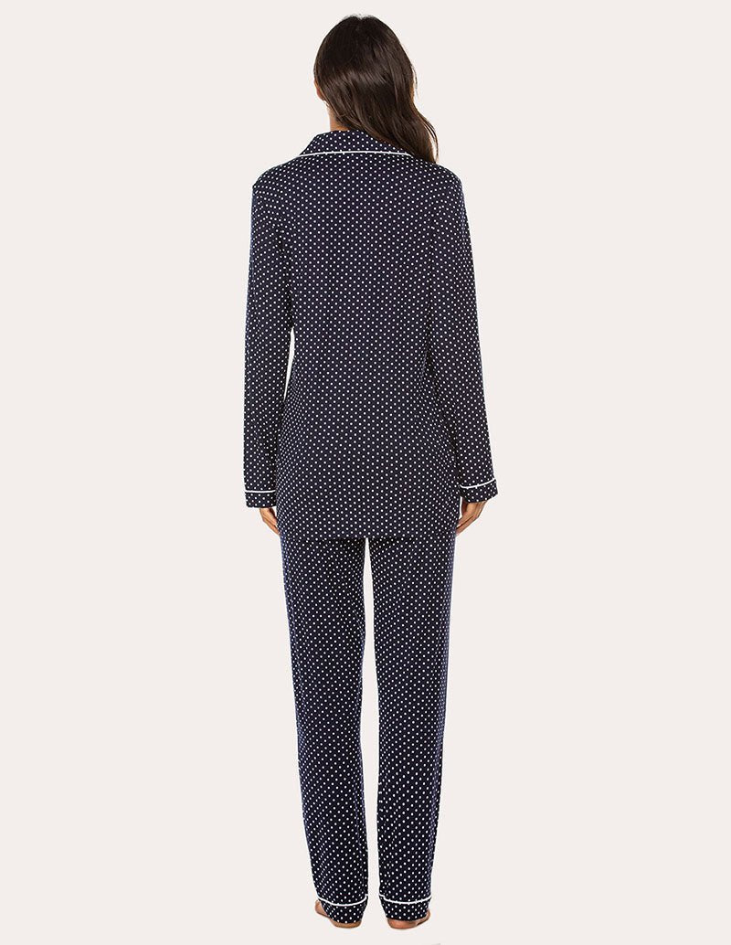 Women’s pajama set back view: dark navy with white dots, long button shirt and tapered pants