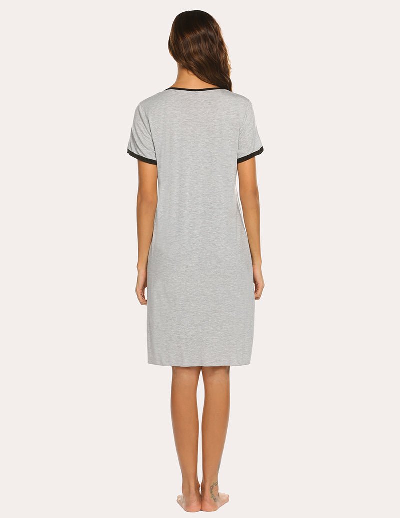 Back view of light grey pleated nightdress with short sleeves and contrast trim