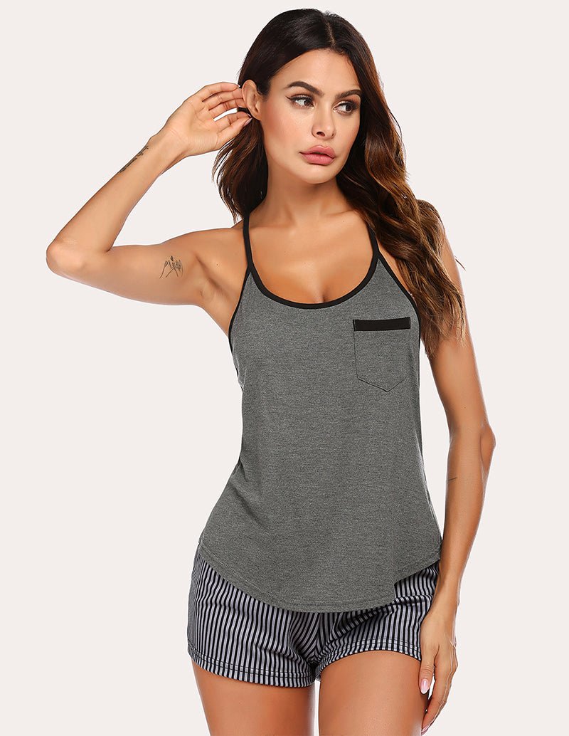 Grey racerback tank and striped shorts pajama set with pocket and contrast trim.