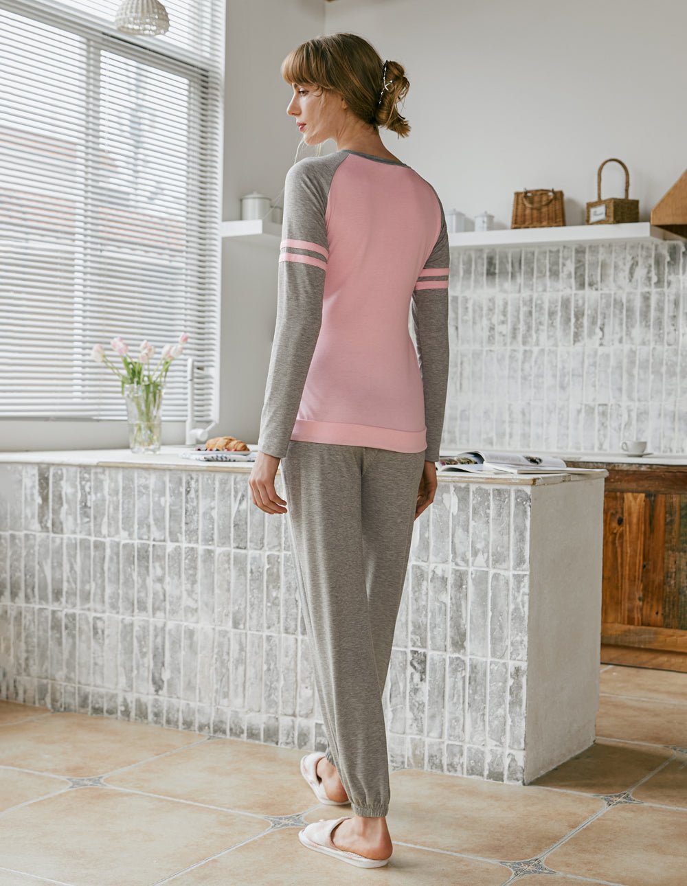 Raglan sleeve pajama set in pink and gray, side view with long jogger pants.