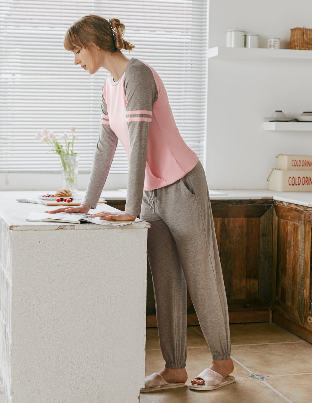 Raglan sleeve pajama set with pink raglan top and gray jogger pants, back view.