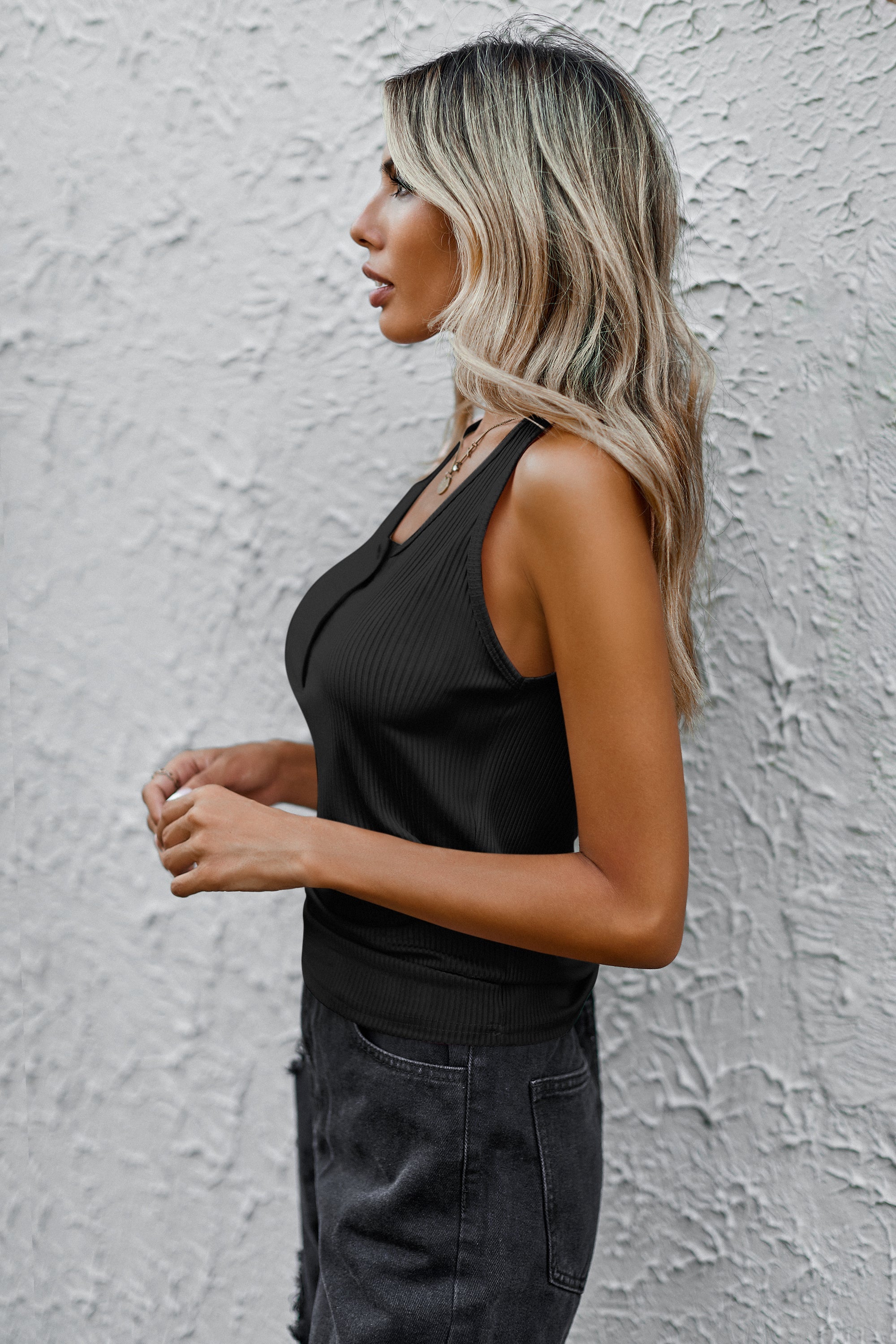 Black ribbed sleeveless tank top with round front neckline