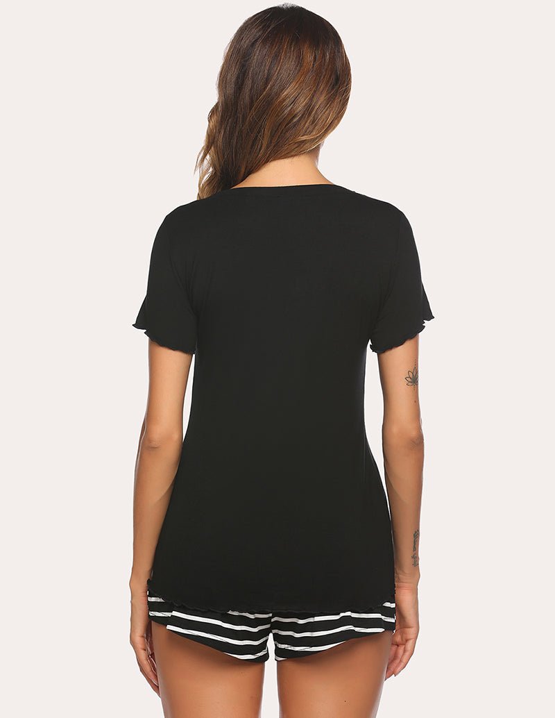 Back view of black pajama set: short-sleeve top with ruffle hem and striped shorts