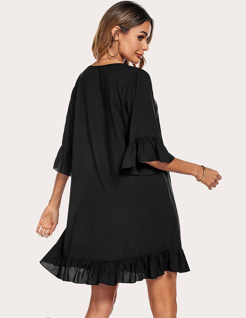 Black ruffled hem sleep dress, back view with gathered cuffs and flared skirt