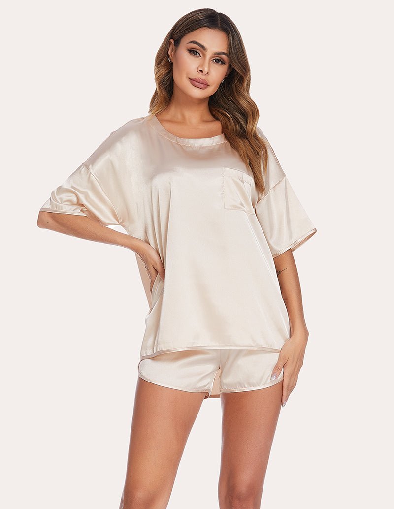 Champagne satin pajama set, front view: short-sleeve top and elastic-waist shorts