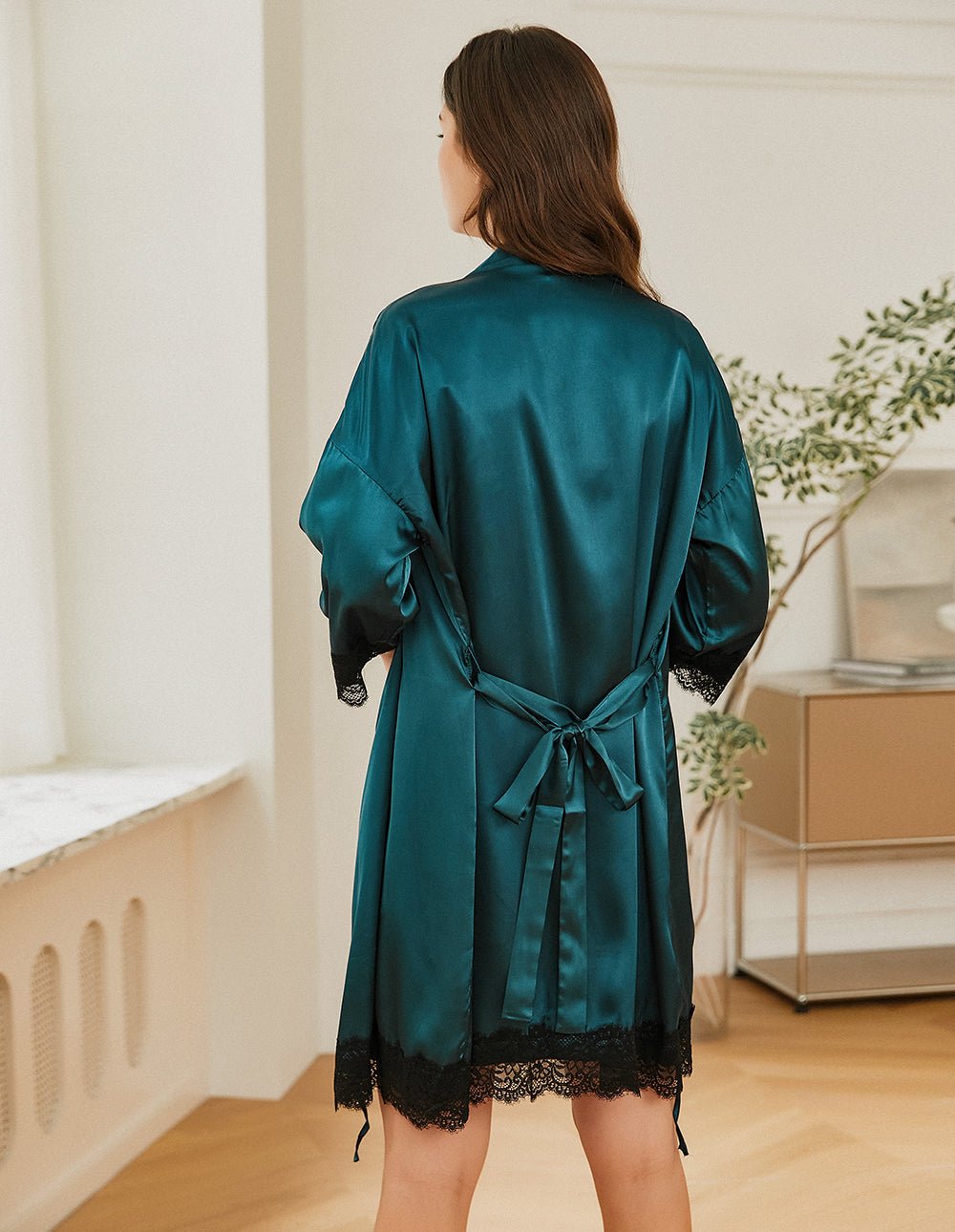 Dark green satin robe, open back with tied waist and black lace trim on sleeves