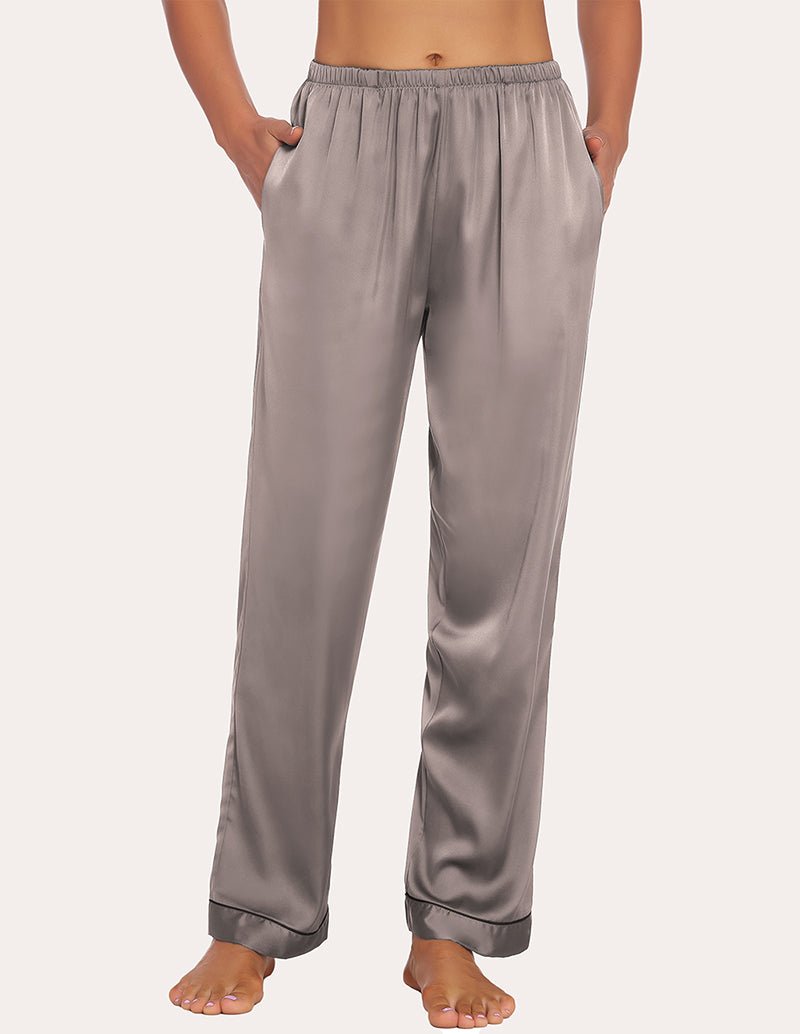 Taupe satin pajama pants with drawstring-style elastic waist and cuffed bottom hems.