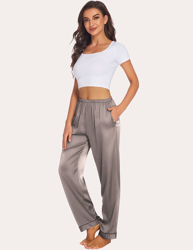 Taupe satin pajama pants with elastic waist, relaxed legs, and cuffed ankle hems.