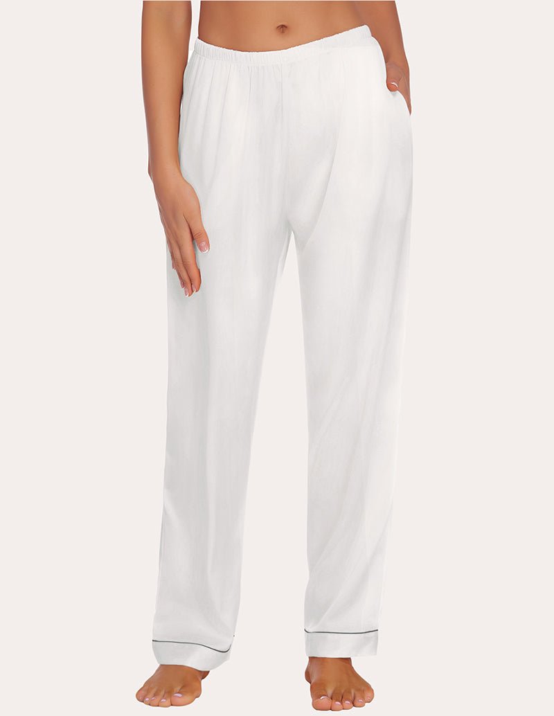 White satin pajama pants with elastic waist and relaxed straight legs; cuffed bottom hems.