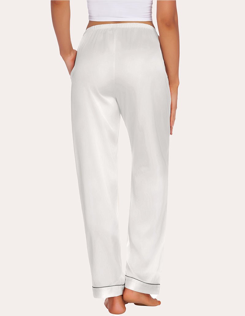 White satin pajama pants with elastic waistband and tapered, cuffed hems.