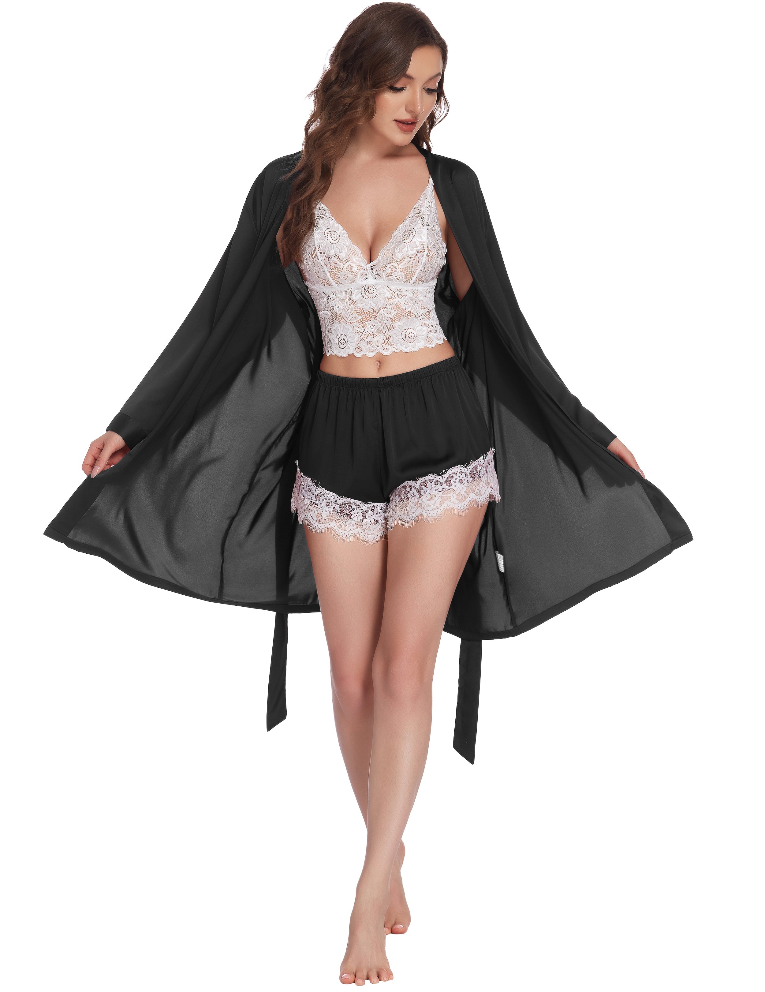 Black satin pajama set with lace bralette and matching shorts, robe open and tied