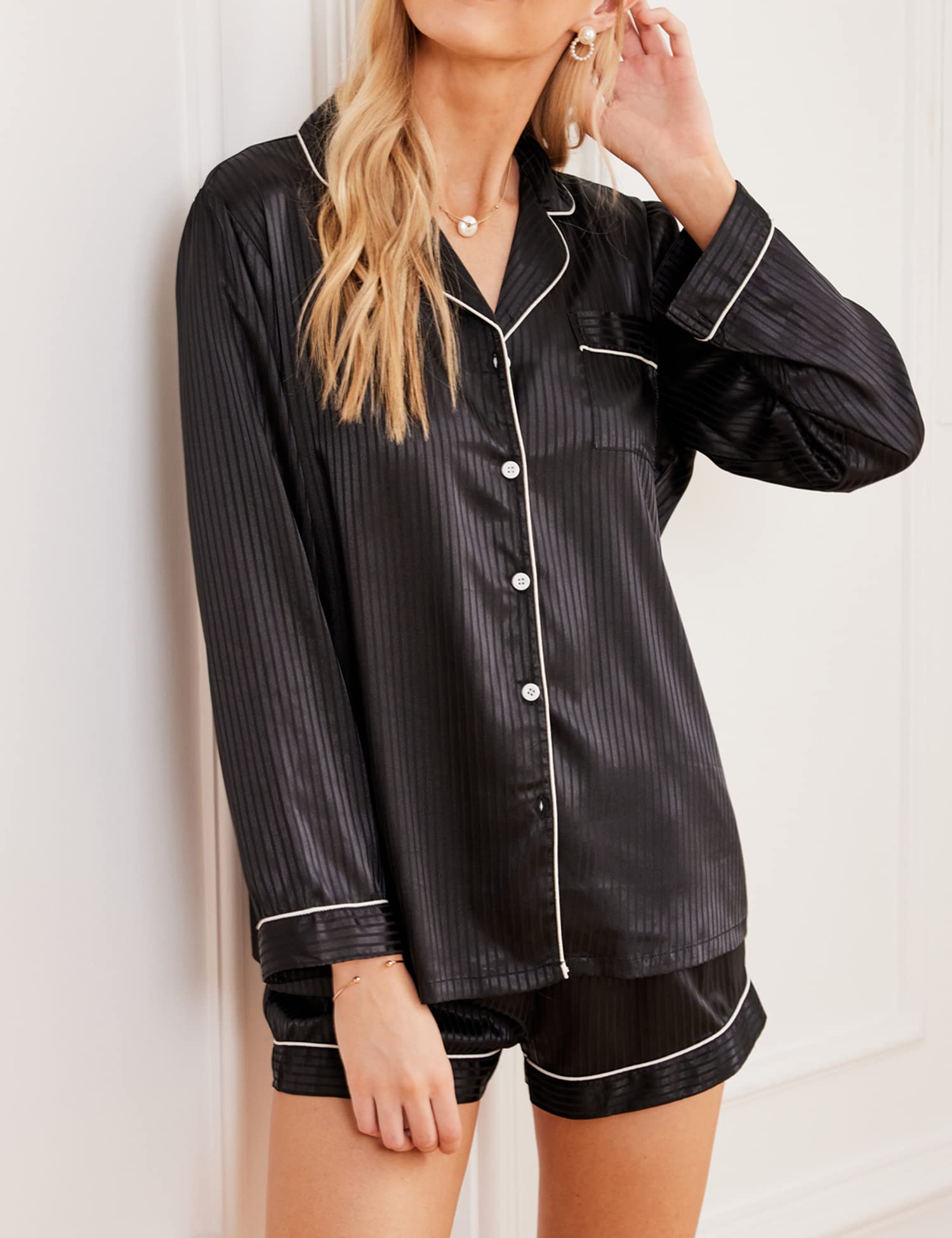 Black satin pajama set: button-up shirt and shorts with contrast trim and piping
