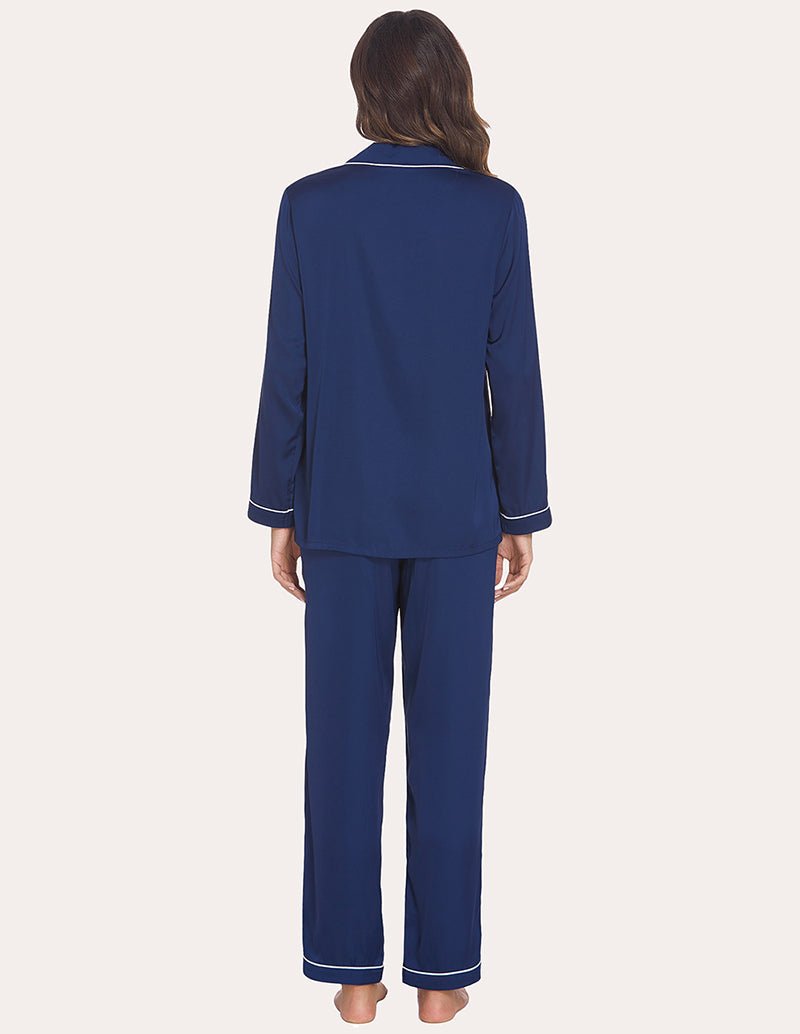 Navy satin pajama set, back view of button shirt and long pants with contrast piping