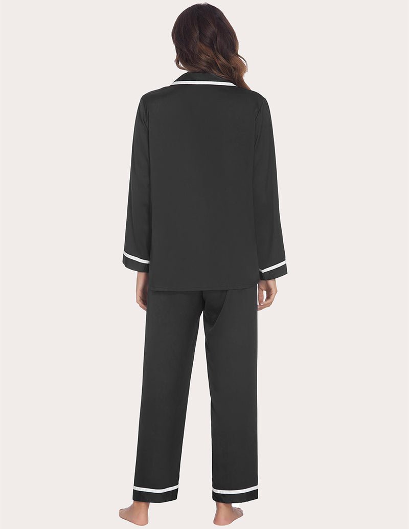 Black satin silk pajama set, back view of button shirt and straight pants with contrast trim