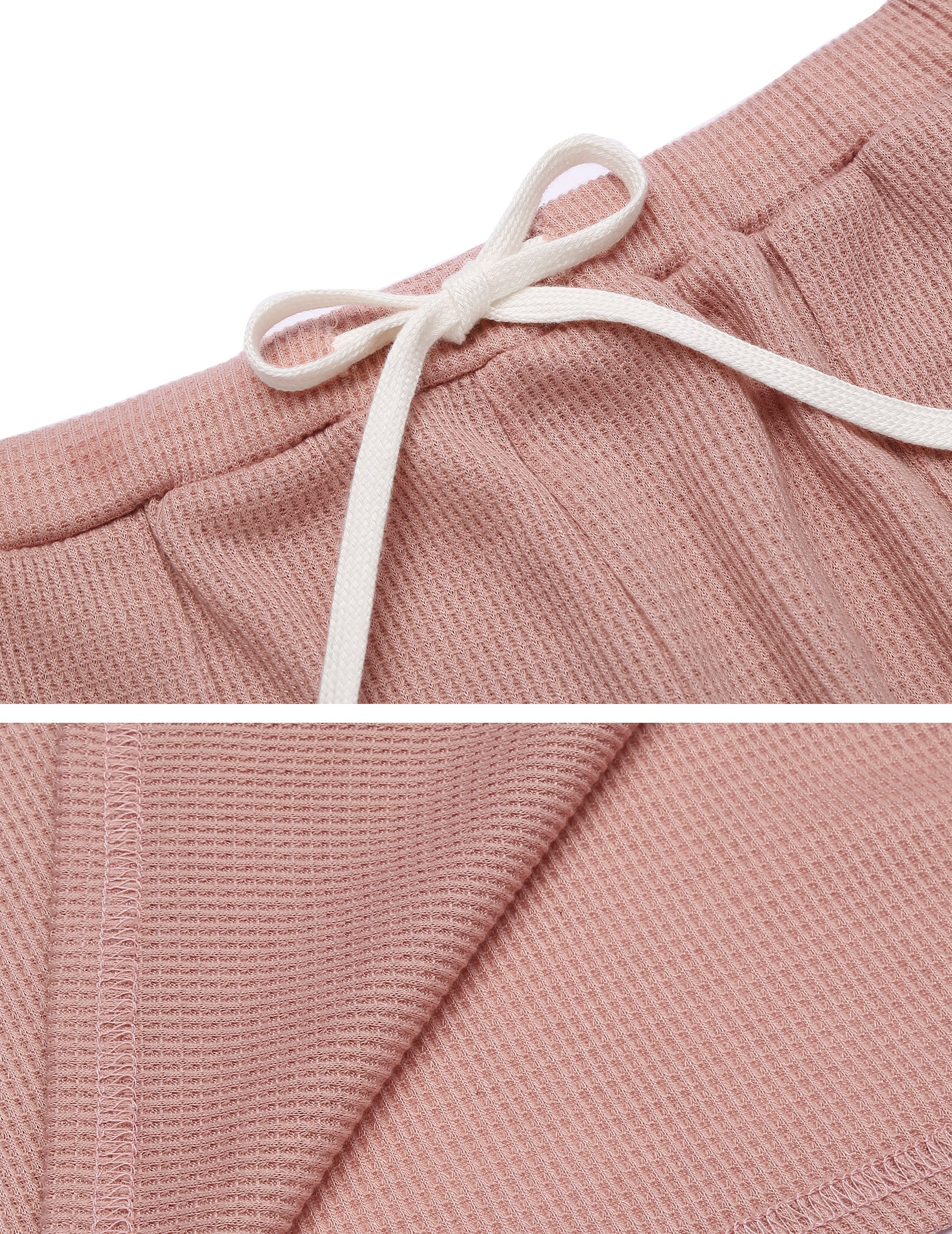 Pink drawstring shorts waistband and textured knit fabric close-up