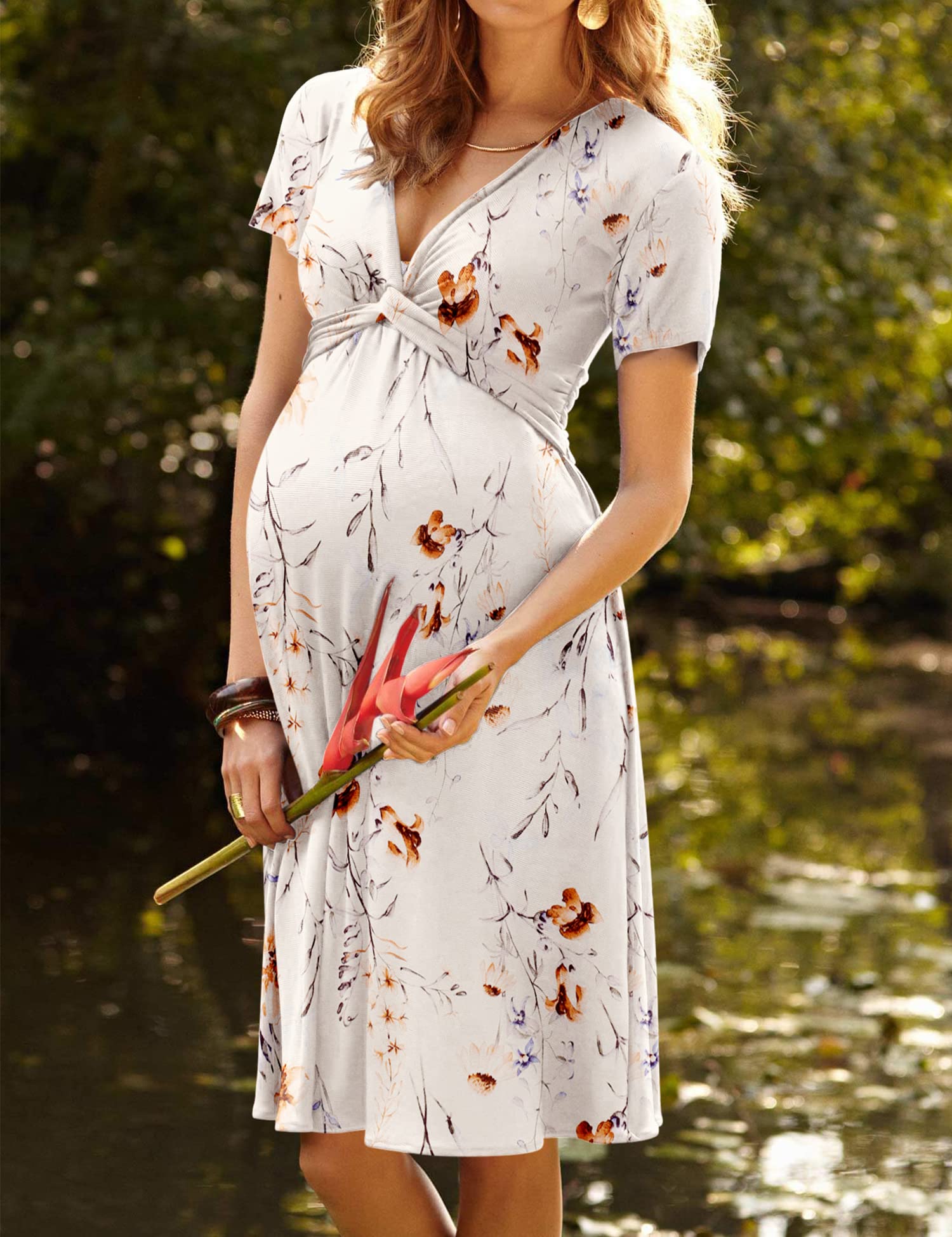 Maternity nursing dress with short sleeves, V-neck, and white floral print with orange