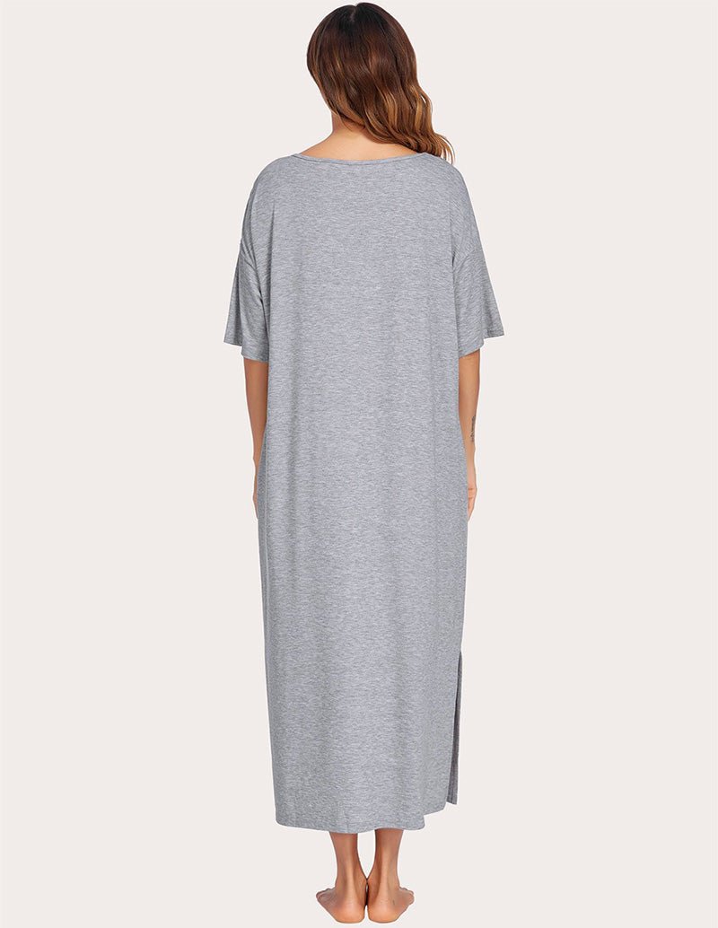 Back view of gray side-split house dress, short sleeves, long hem with center slit
