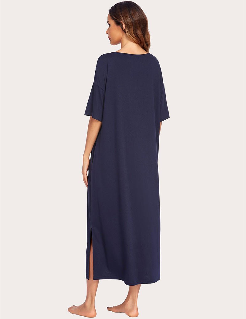 Back view of navy side-split house dress, short sleeves and center slit hem
