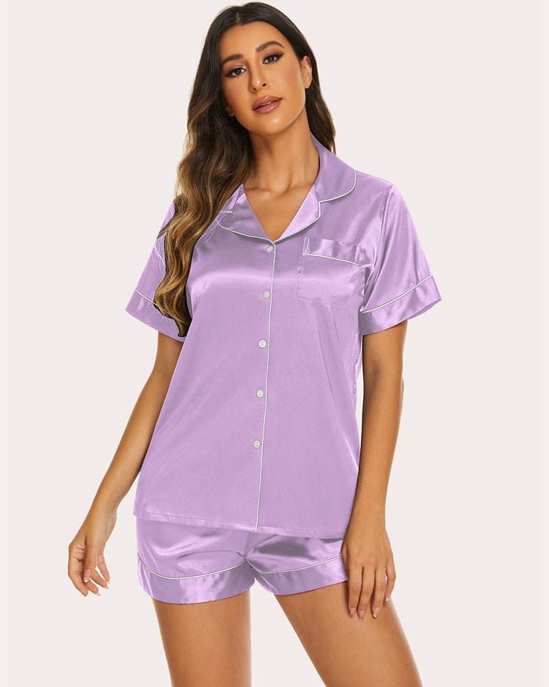 Lilac silk pajama set with contrast piping: short-sleeve button top and matching elastic waist shorts