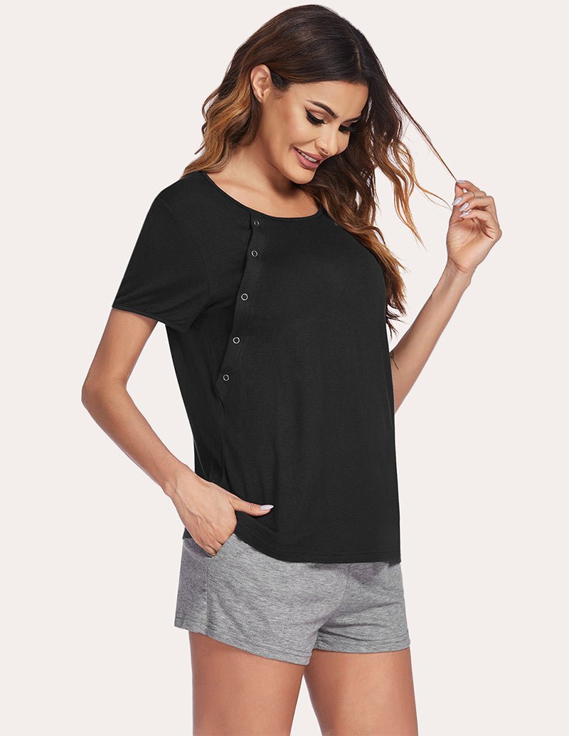 Black nursing pajama top with button front and gray drawstring shorts, side pose