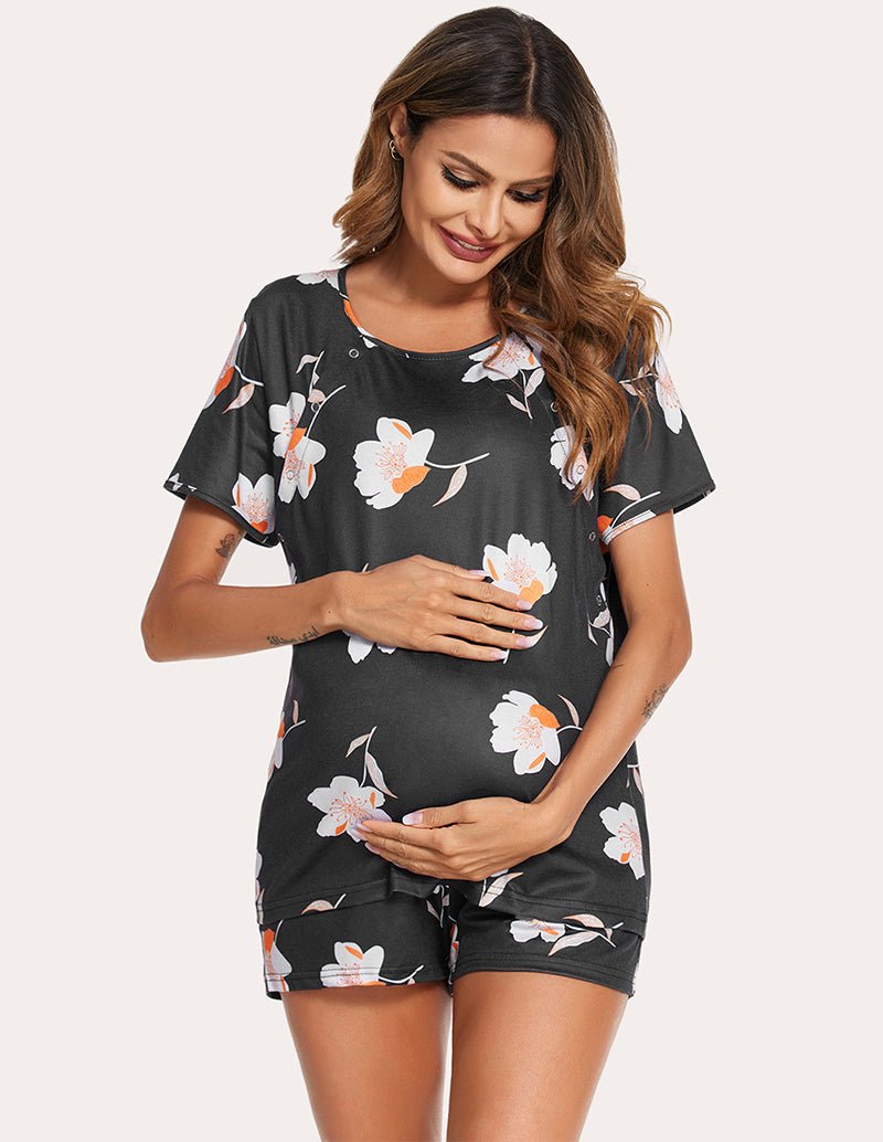 Black nursing pajama set with floral print short-sleeve top and matching drawstring shorts