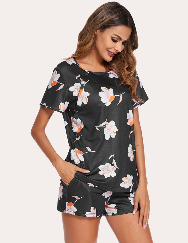 Black nursing pajama set with floral print top and matching shorts, side view