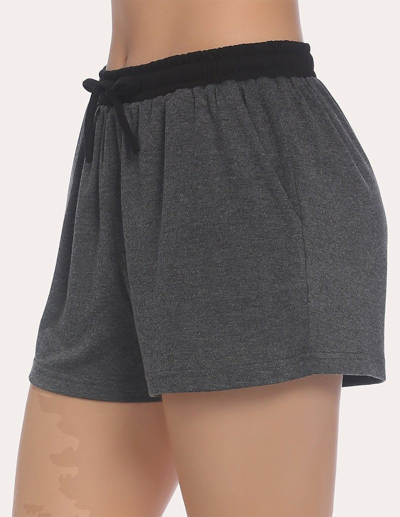 Dark heather gray pajama shorts with black elastic waistband and tied drawstring, side view