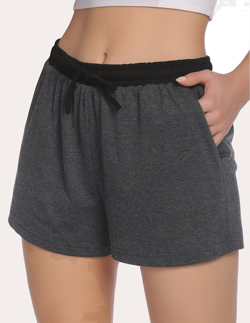 Dark heather gray pajama shorts with black elastic waistband, tied drawstring at center