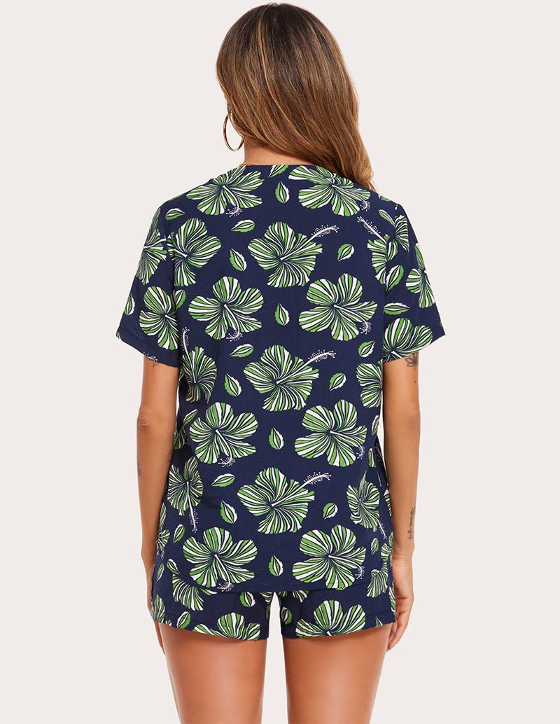 Back view of navy leaf-print pajama set: short-sleeve button top and matching shorts