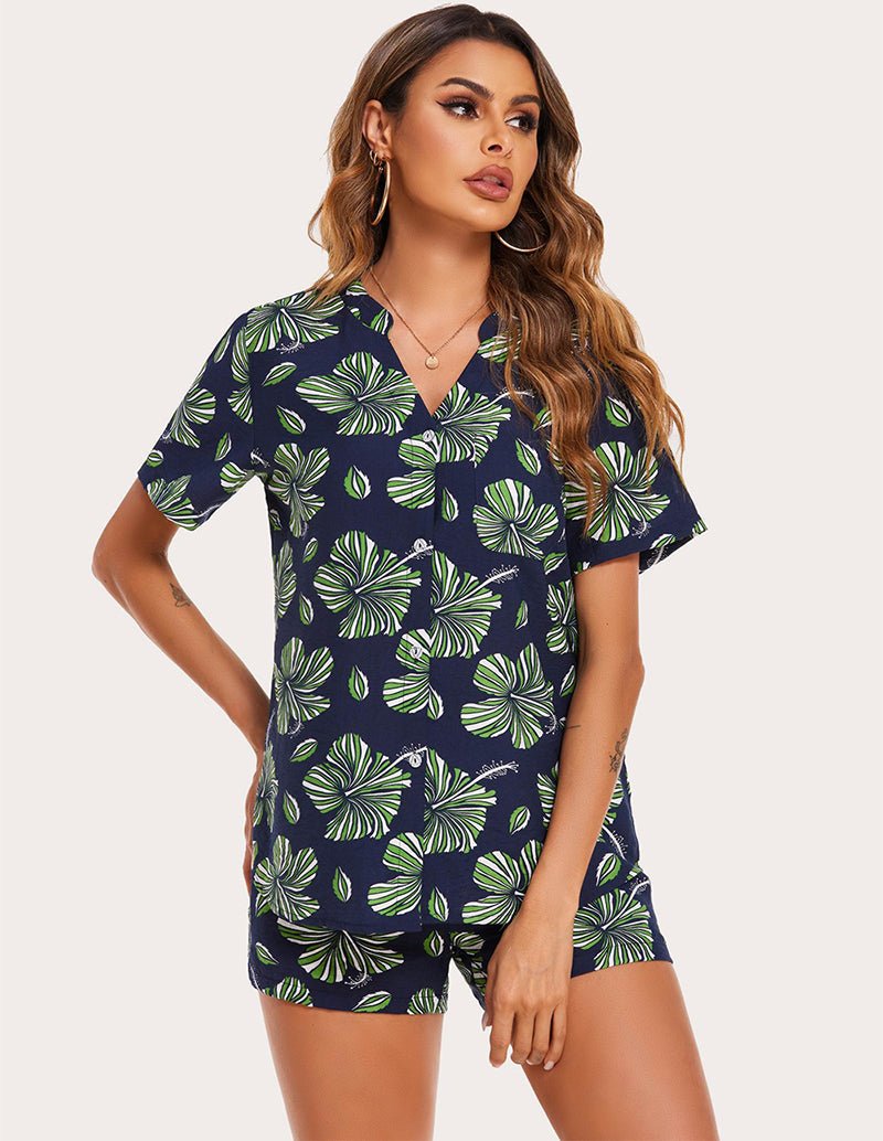 Navy pajama set with green leaf print: button-front short-sleeve top and shorts