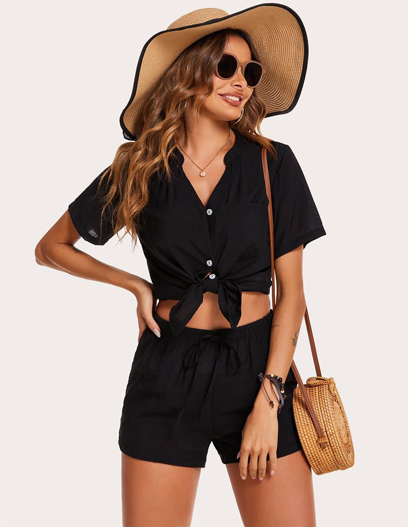 Black pajama top tied hem with matching shorts, short sleeves, button front