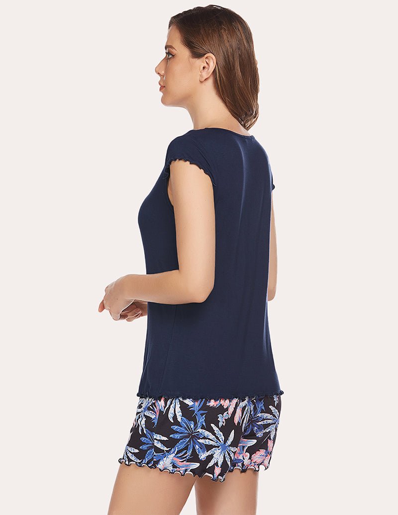 Side view of navy T-shirt and floral printed shorts set with ruffled sleeves