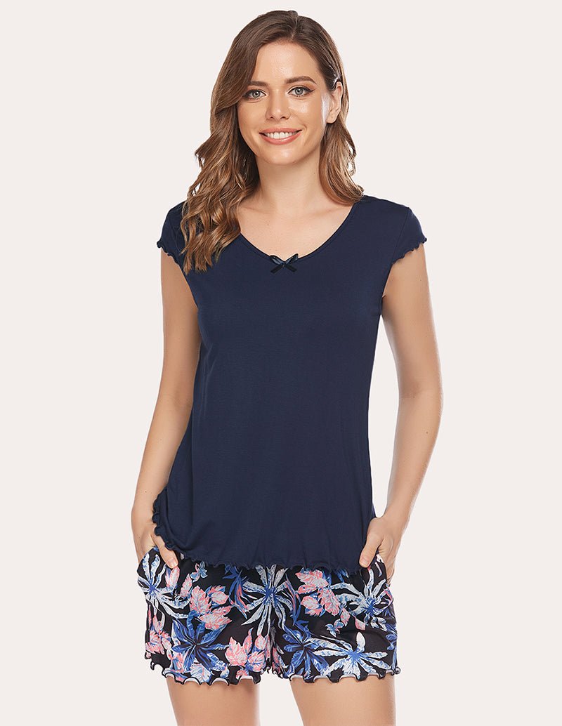 Navy V-neck T-shirt with short sleeves and floral printed shorts, full outfit