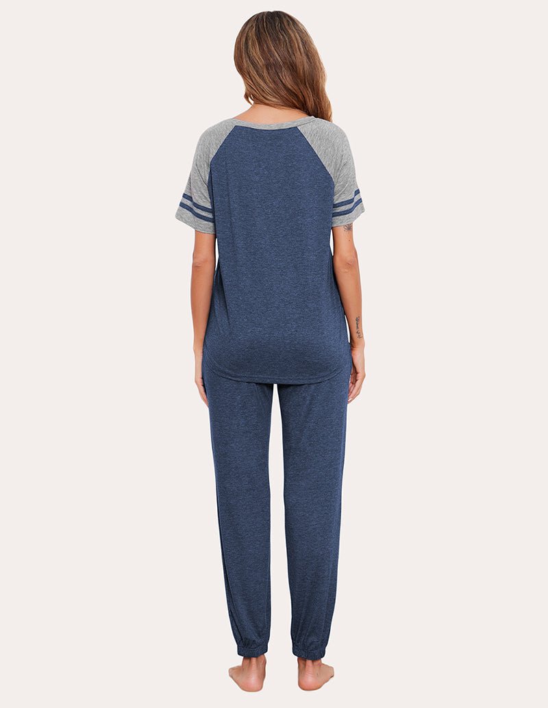 Back view of cobalt blue striped patchwork pajama set with raglan tee and jogger pants