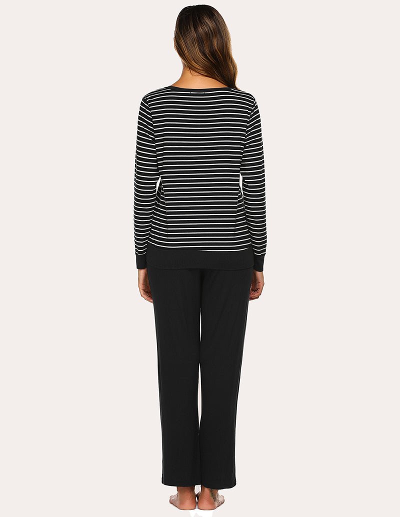 Back view: black long-sleeve striped V-neck top with solid black pajama pants
