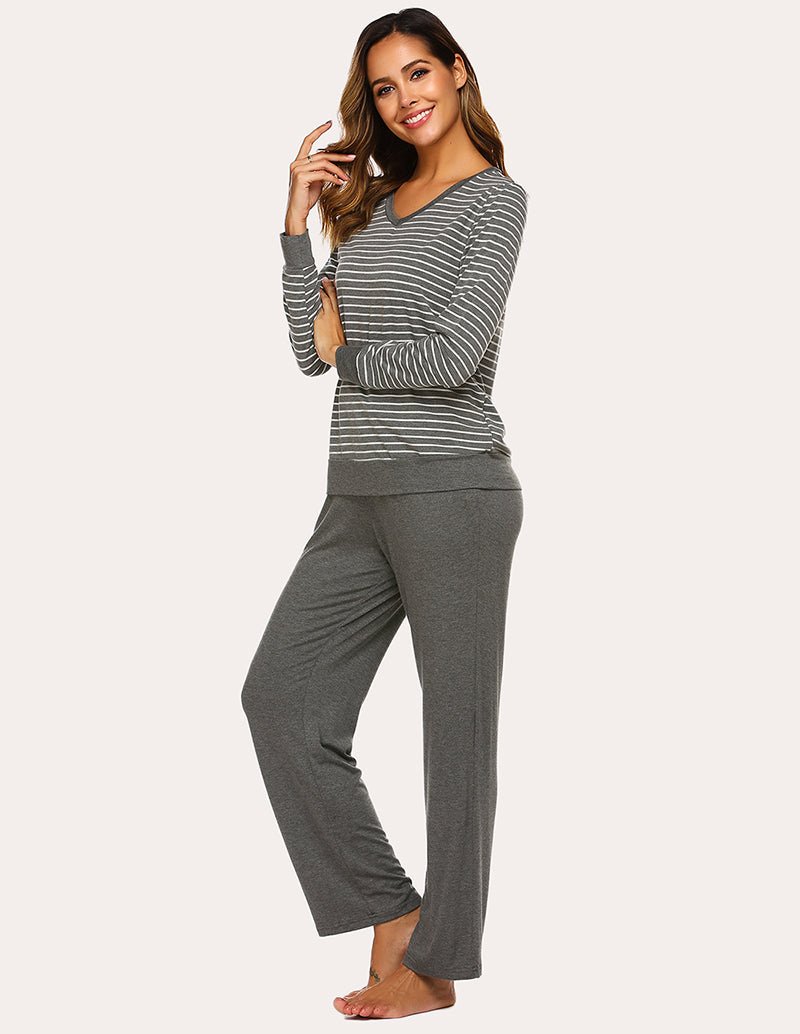 Women’s striped pajama top and solid pants set, angled view with gray and white stripes